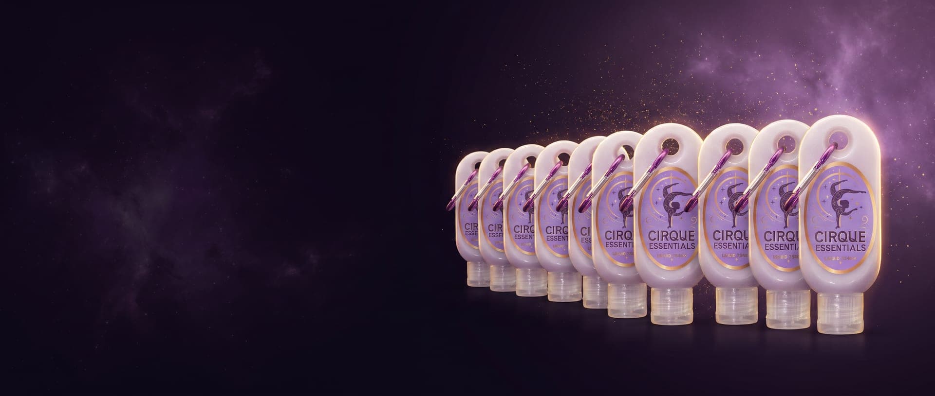 A row of Cirque Essentials liquid chalk bottles receding into a starry background